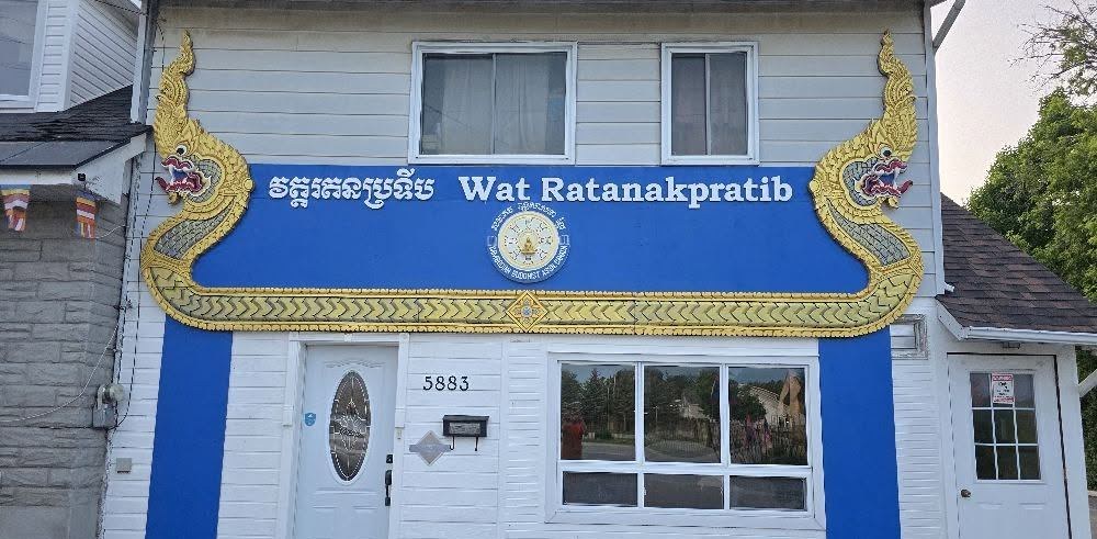 The temple building on Hazeldean Road, with its blue Khmer and English sign framed by gold carved ends